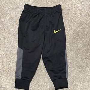 Nike Kids Black and Gray Joggers with Yellow Logo